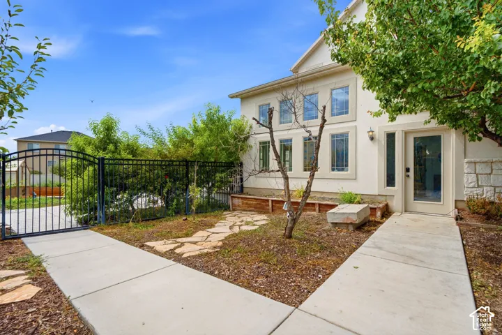 Cream stucco exterior with stacked stone accents