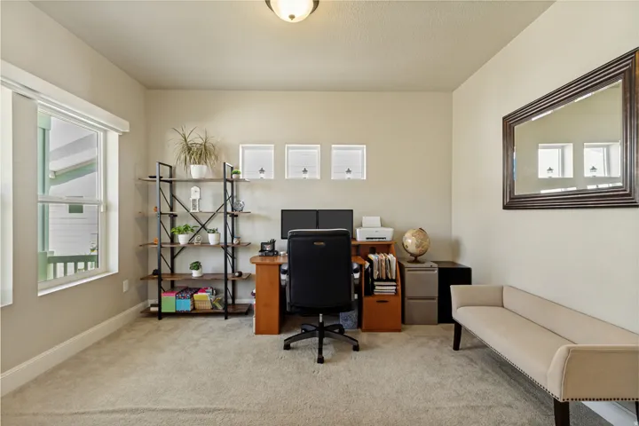 Versatile room featuring a window, neutral wall tones, and recessed ceiling lighting