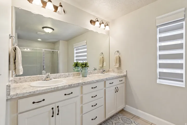 Double vanity with laminate countertops and two undermount sinks
