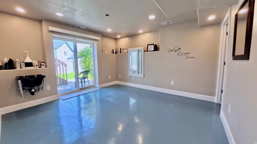 Recessed lighting and a light-toned ceiling