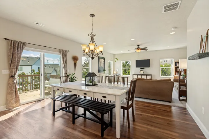 Open-concept living area featuring a decorative chandelier, and recessed lighting