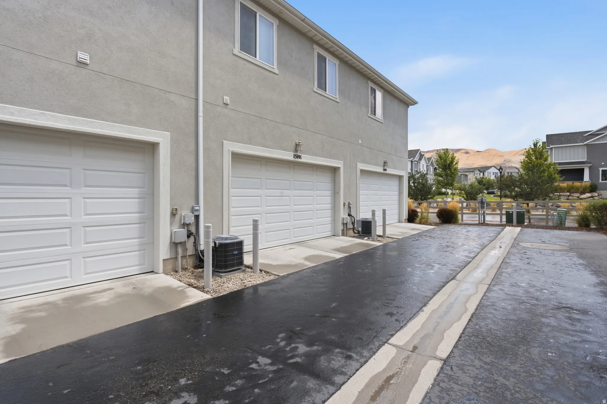 Three garage doors with panel detailing