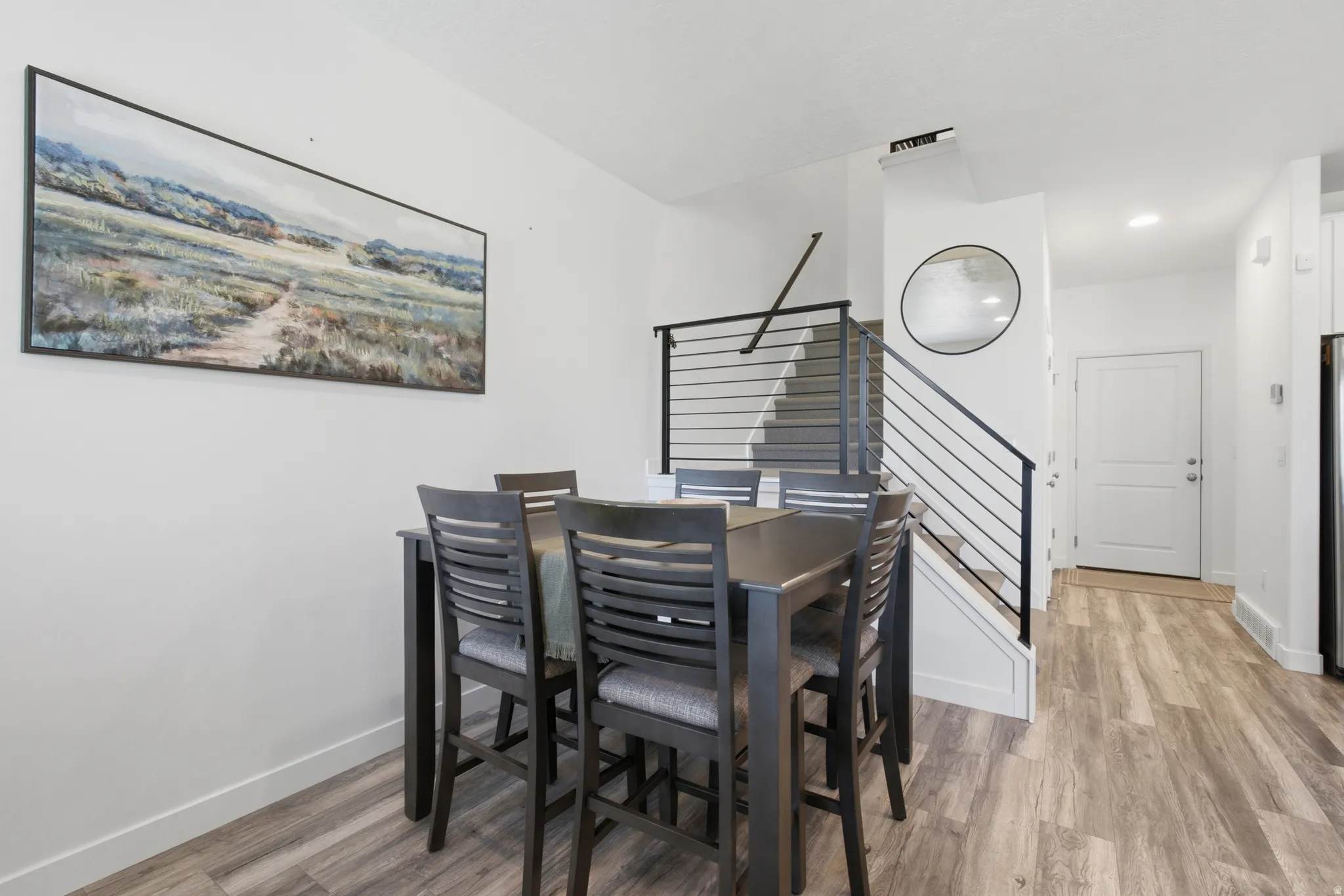 Hard-surface flooring extending throughout the space