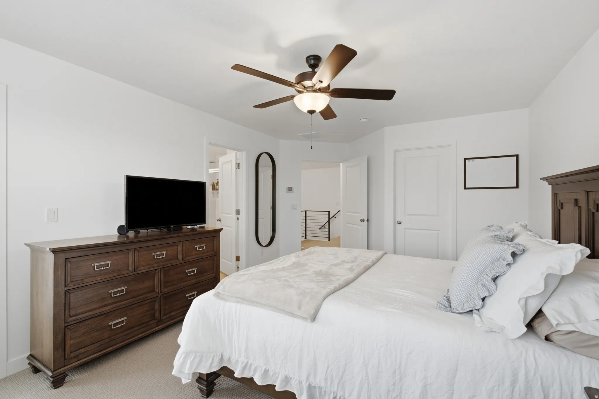 Interior room with light colored walls and carpet flooring