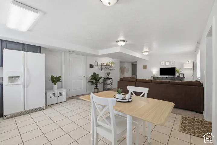Kitchen area featuring white tile flooring.