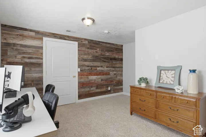 Textured wood-panel accent wall give this room a unique look.