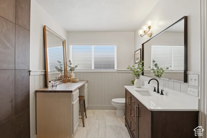 Open and naturally lit ensuite bathroom with modern finishes.
