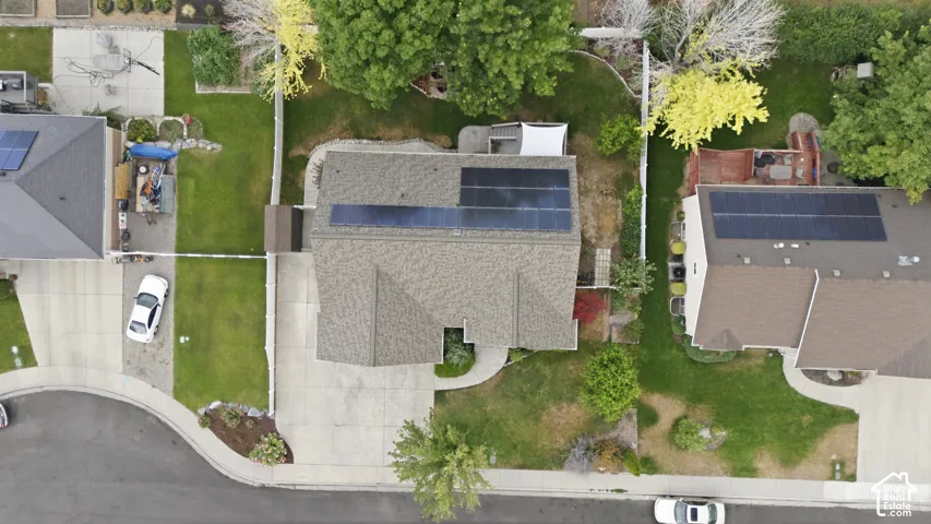 Energy-efficient solar panels along roof at the back of the home.
