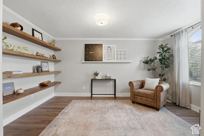 A welcoming sitting room featuring multiple built-in floating wood shelves.