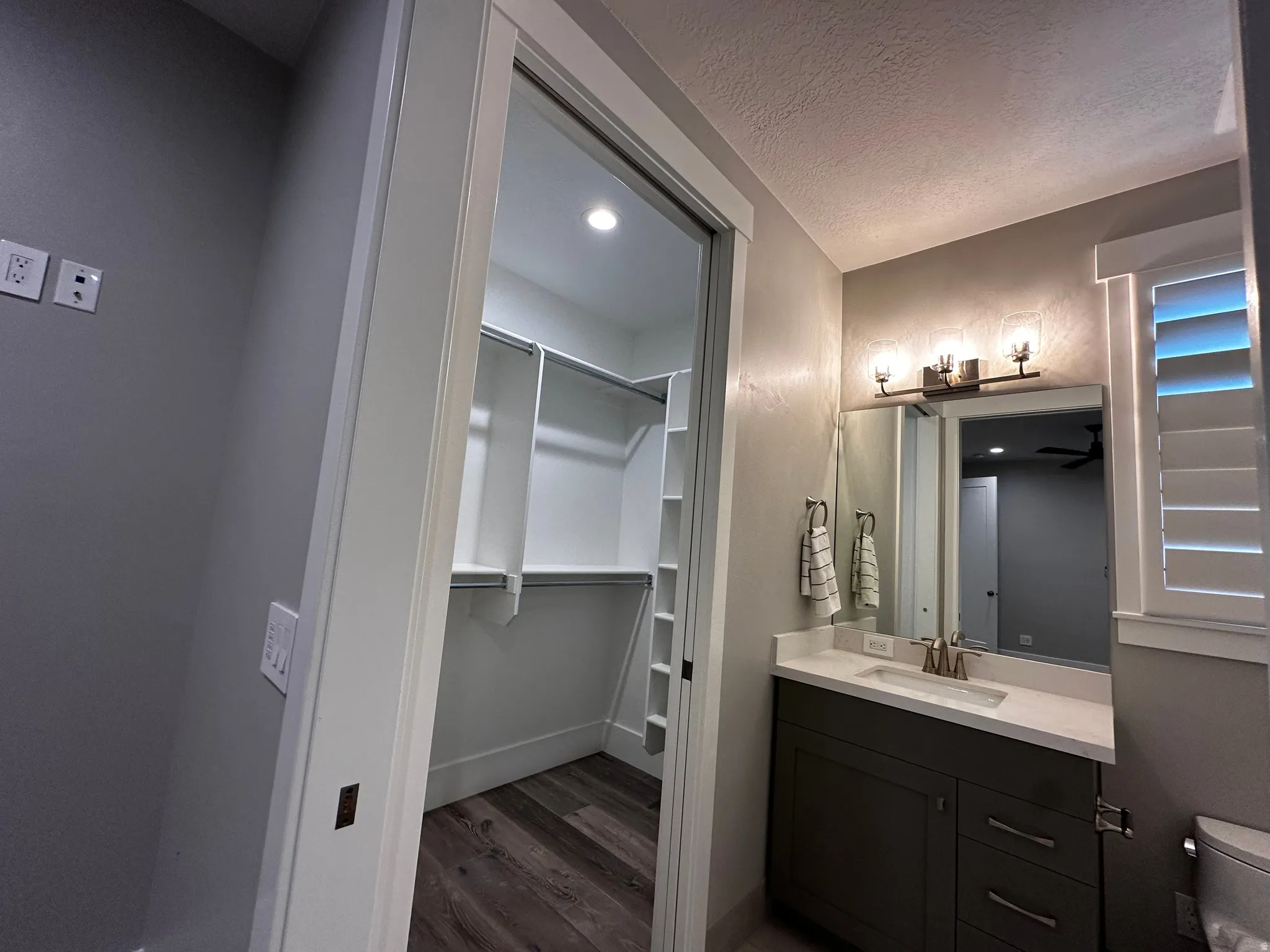 Bathroom vanity with a white countertop and a rectangular undermount sink