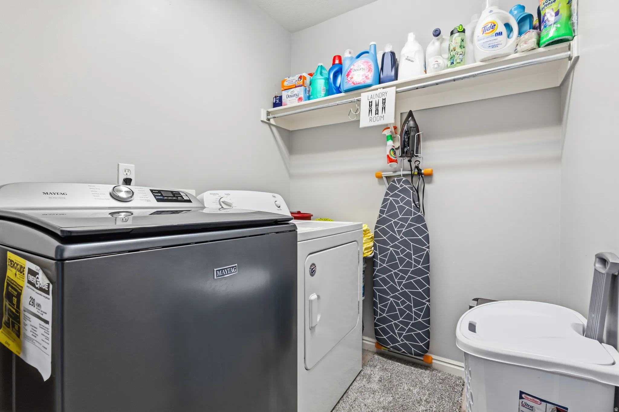 Dedicated laundry area with shelving