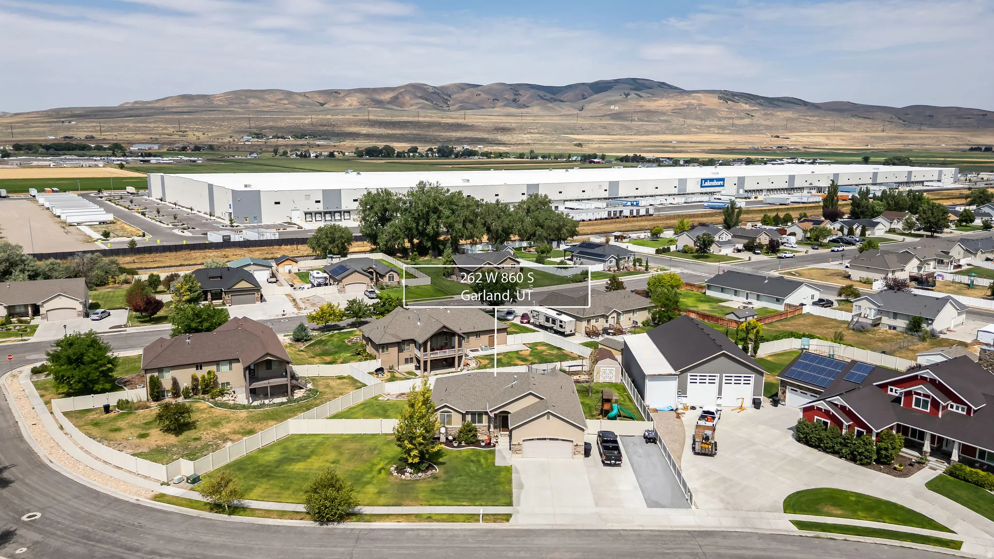 Residential neighborhood with varied home styles and mountain backdrop