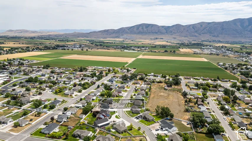 Aerial perspective showcasing the residential neighborhood with a mountainous backdrop