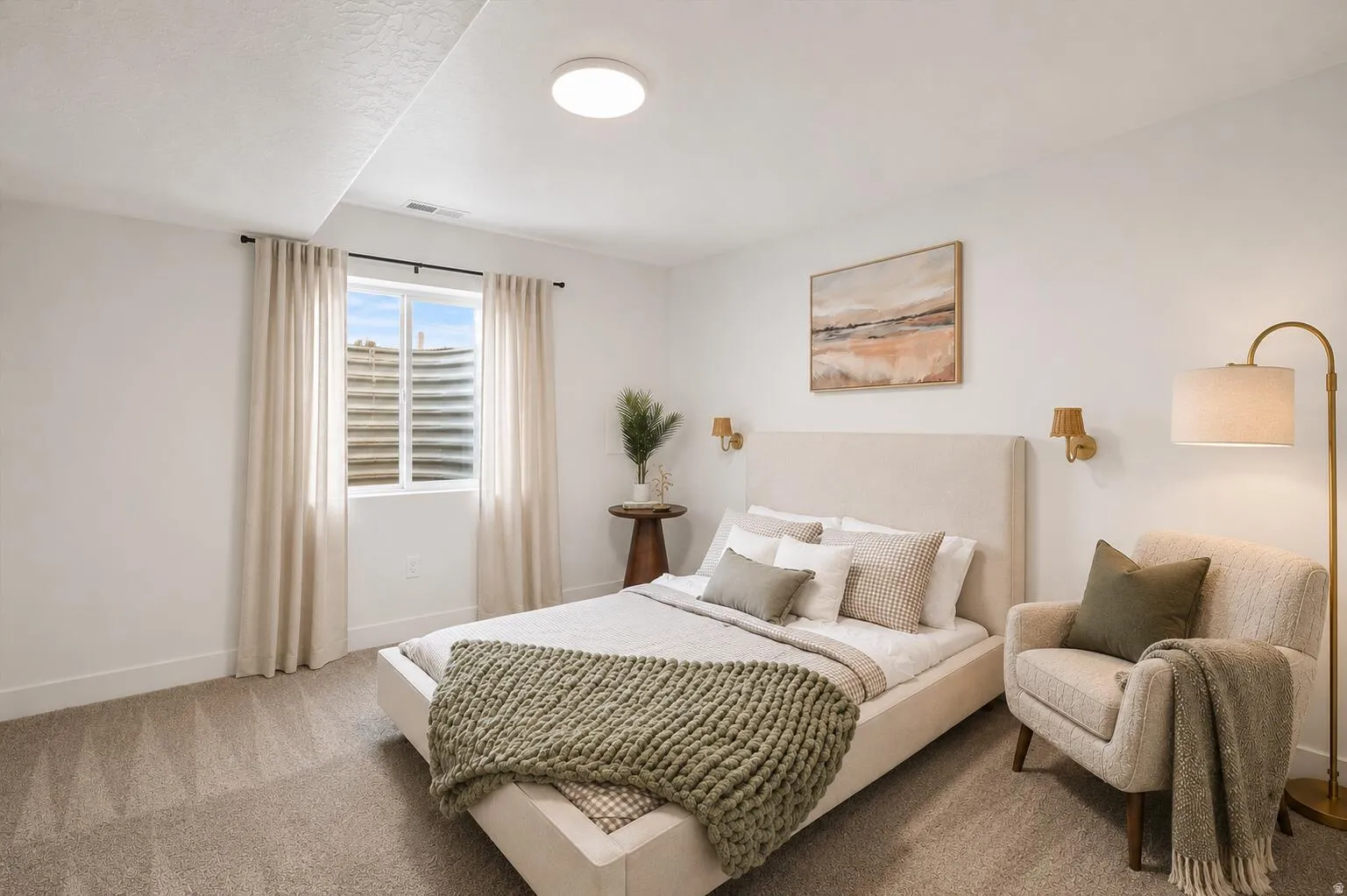 Carpeted bedroom featuring a large window with privacy blinds, recessed ceiling lighting, and wall-mounted sconces
