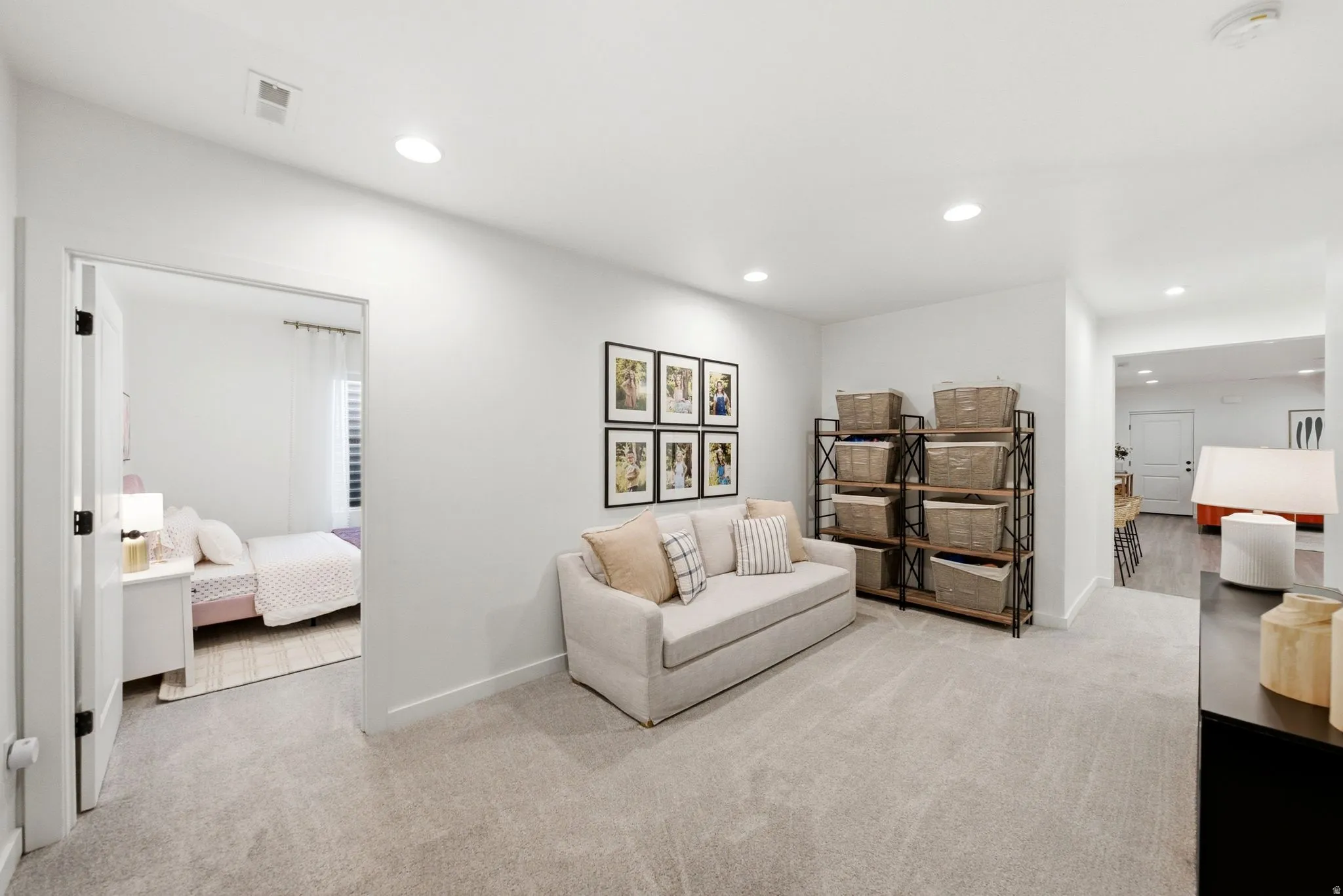 Carpeted hallway space featuring recessed lighting