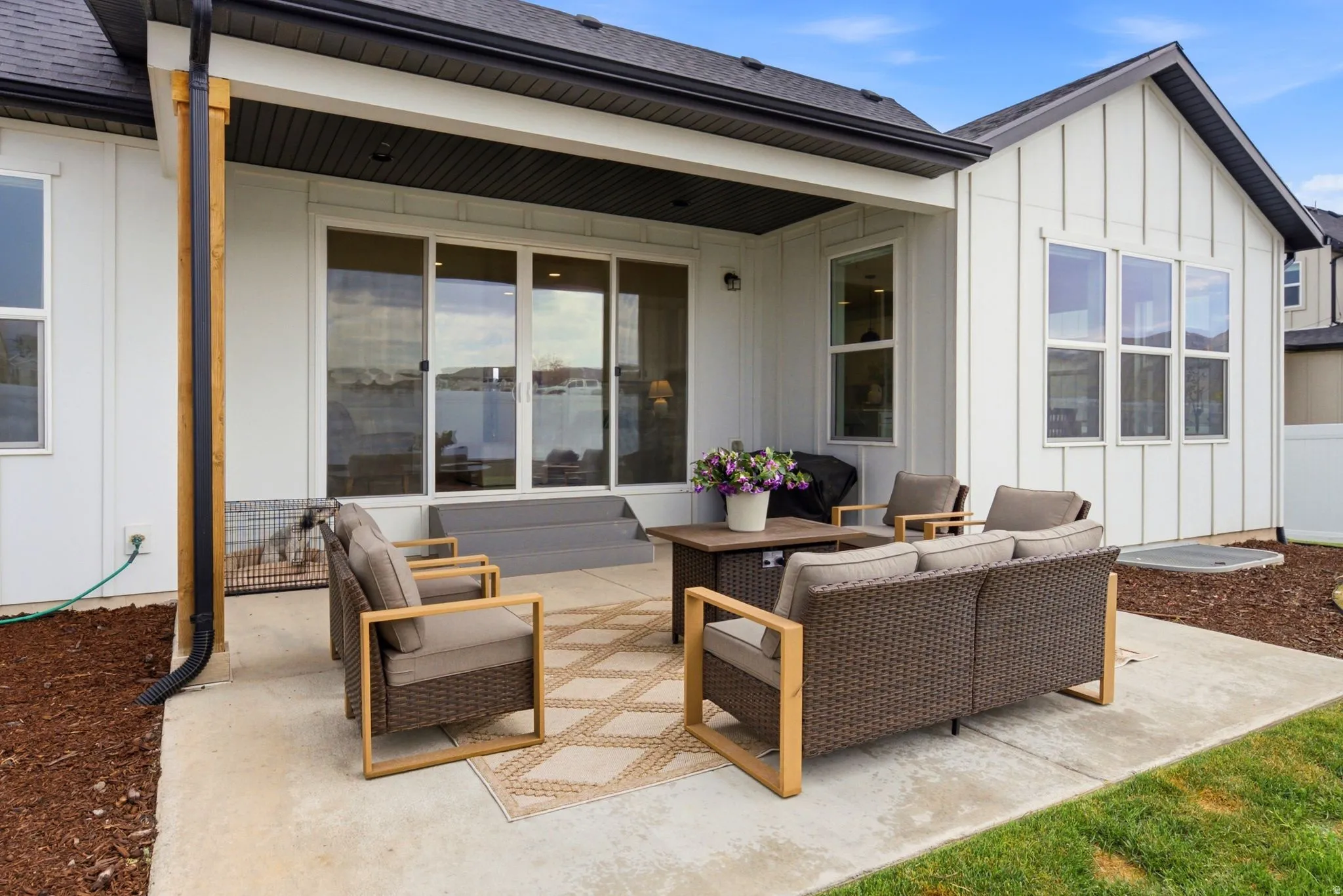 Concrete patio area featuring a sliding glass door entry to the interior