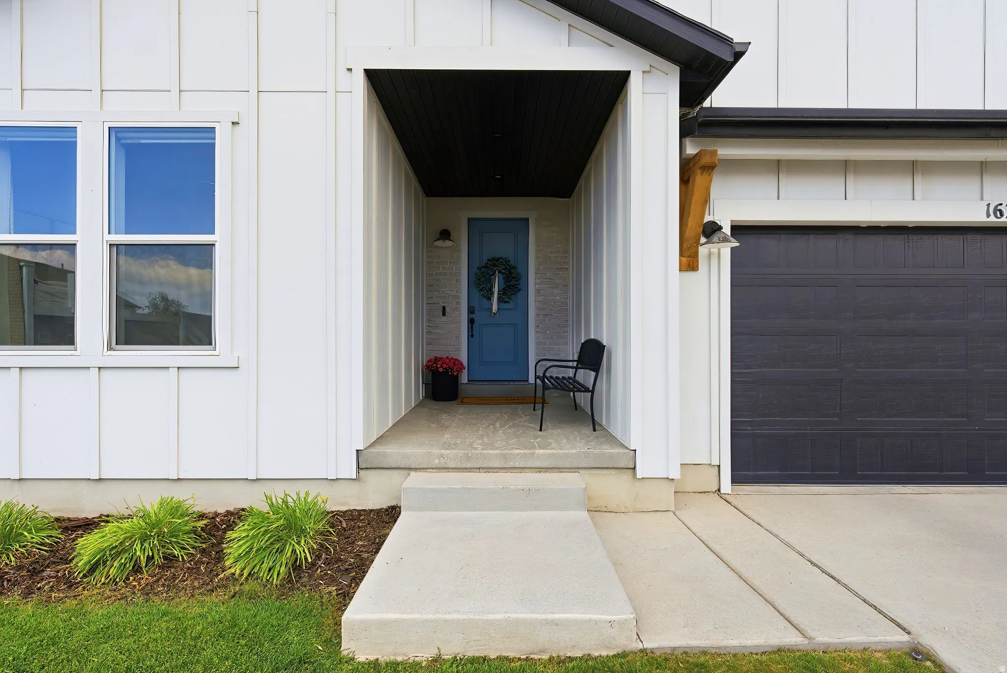Contemporary exterior featuring crisp white board and batten siding