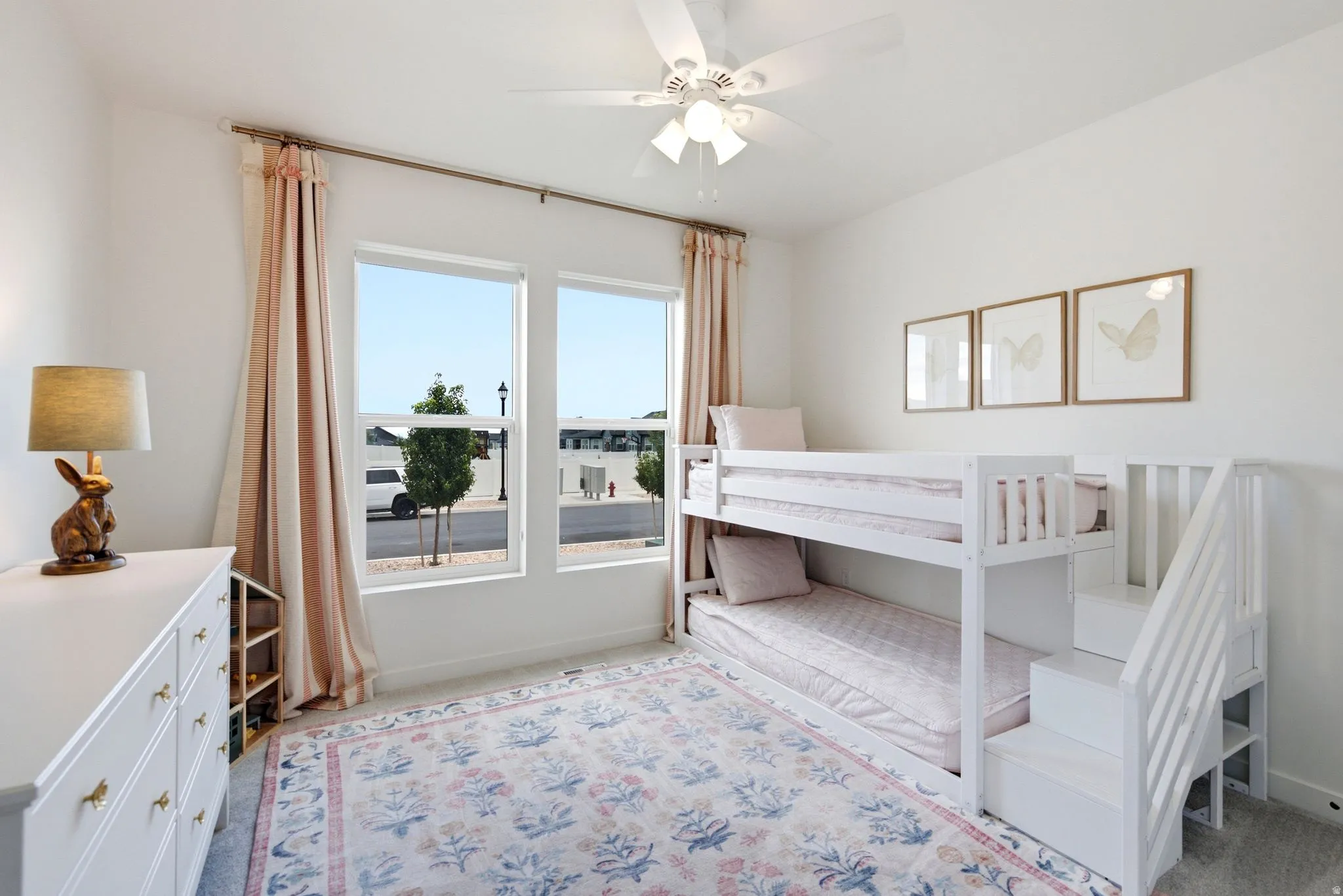 Bright room featuring dual vertical windows