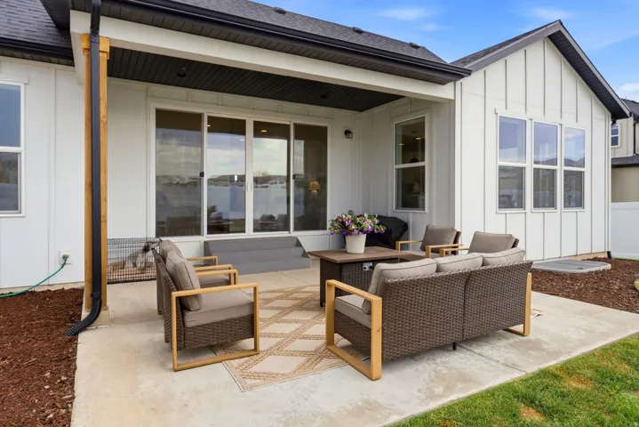 Concrete patio area featuring a sliding glass door entry to the interior
