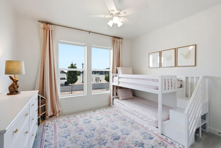 Bright room featuring dual vertical windows