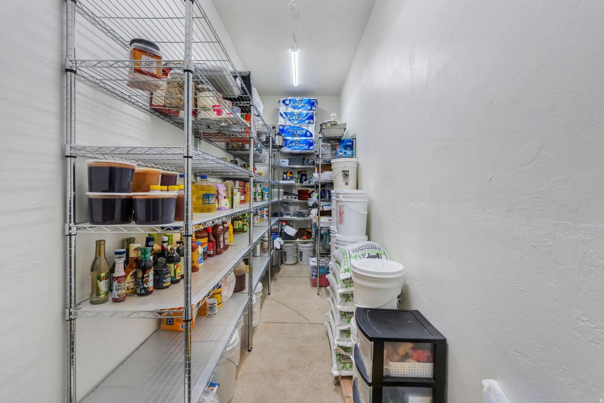 Dedicated pantry space featuring extensive wire shelving for comprehensive storage
