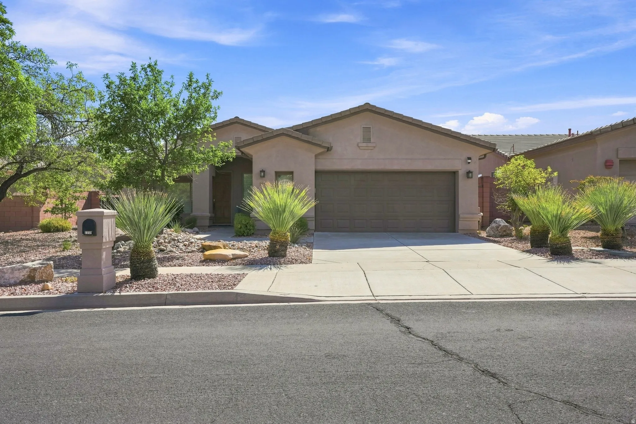 Single-story residence featuring a stucco exterior with a tiled roof