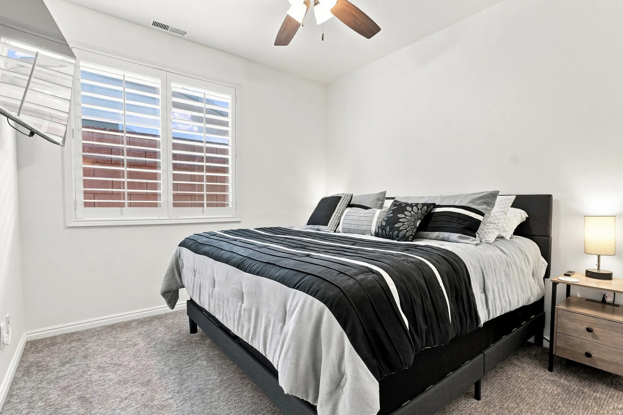 Neutral-toned carpeting and white walls create a serene atmosphere