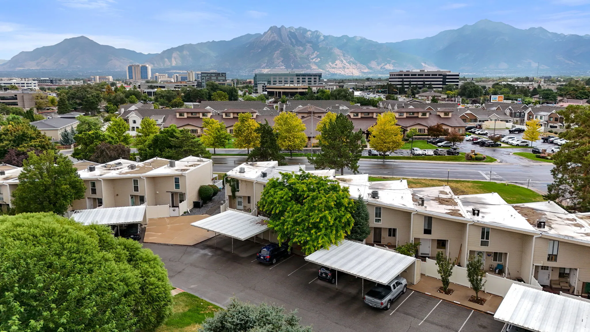 Aerial perspective showcasing multi-level residential units with dedicated covered parking structures