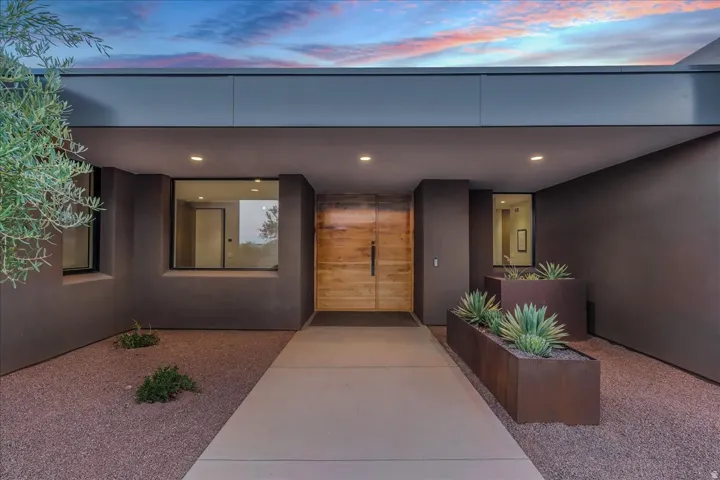 Modern exterior featuring a custom entry door