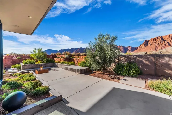 Outdoor lounge area with built in fire pit off of the main kitchen area