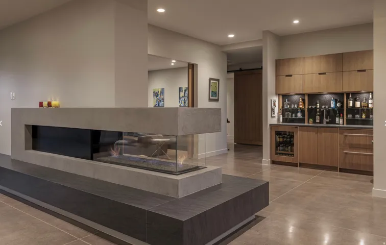Great room three sided gas fireplace and wet bar
