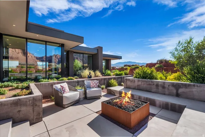 Outdoor lounge area with built in fire pit off of the main kitchen area