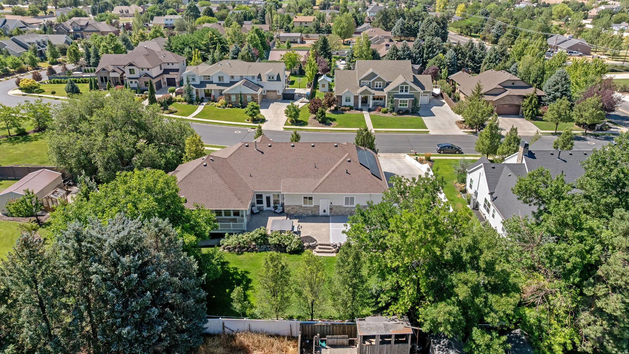Expansive property featuring mature trees and a manicured lawn