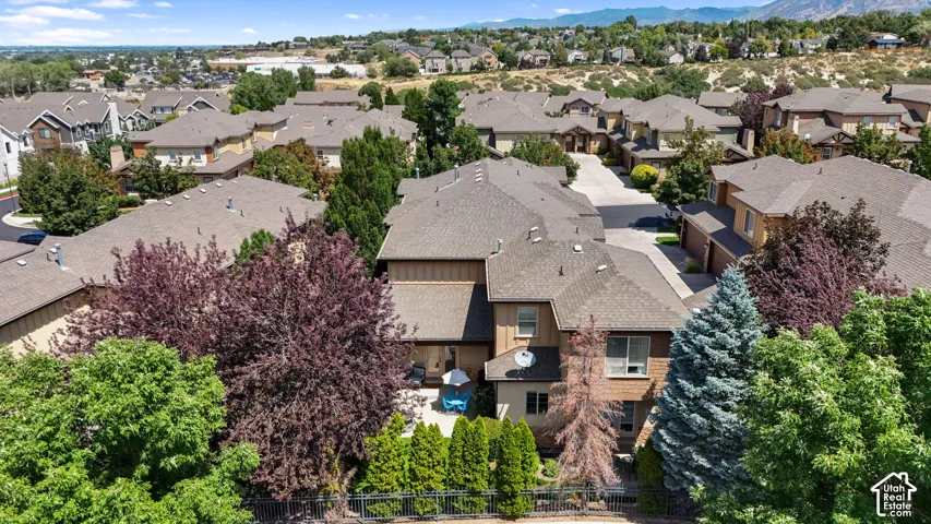 Terraced lot with established landscaping and a fenced yard