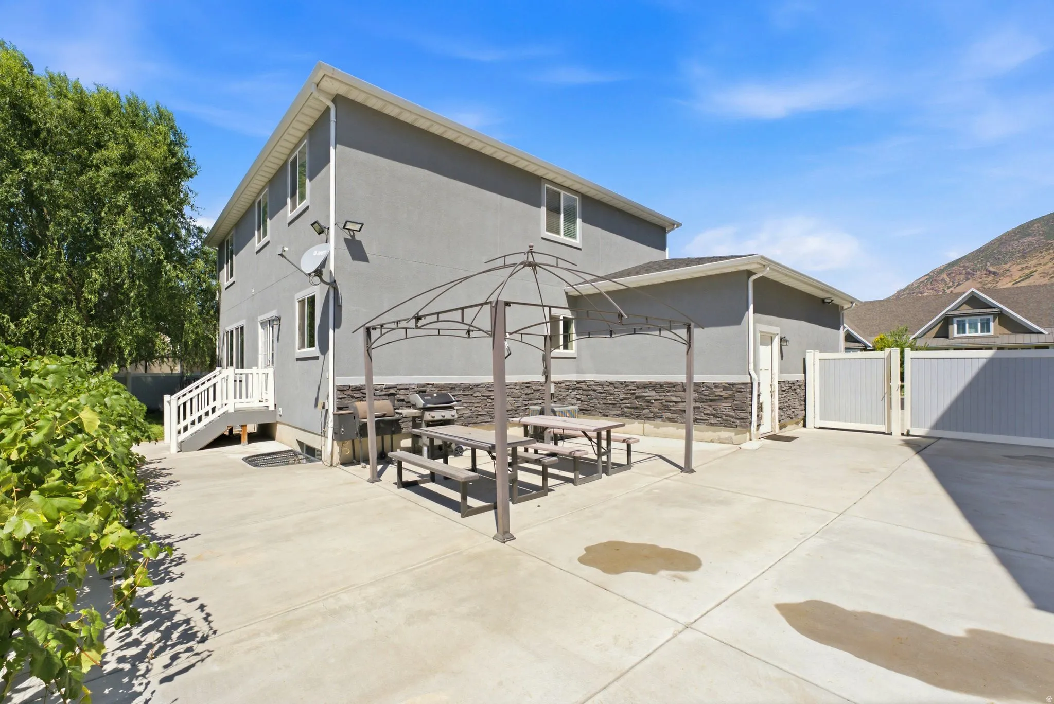 Expansive concrete patio with a permanent gazebo structure