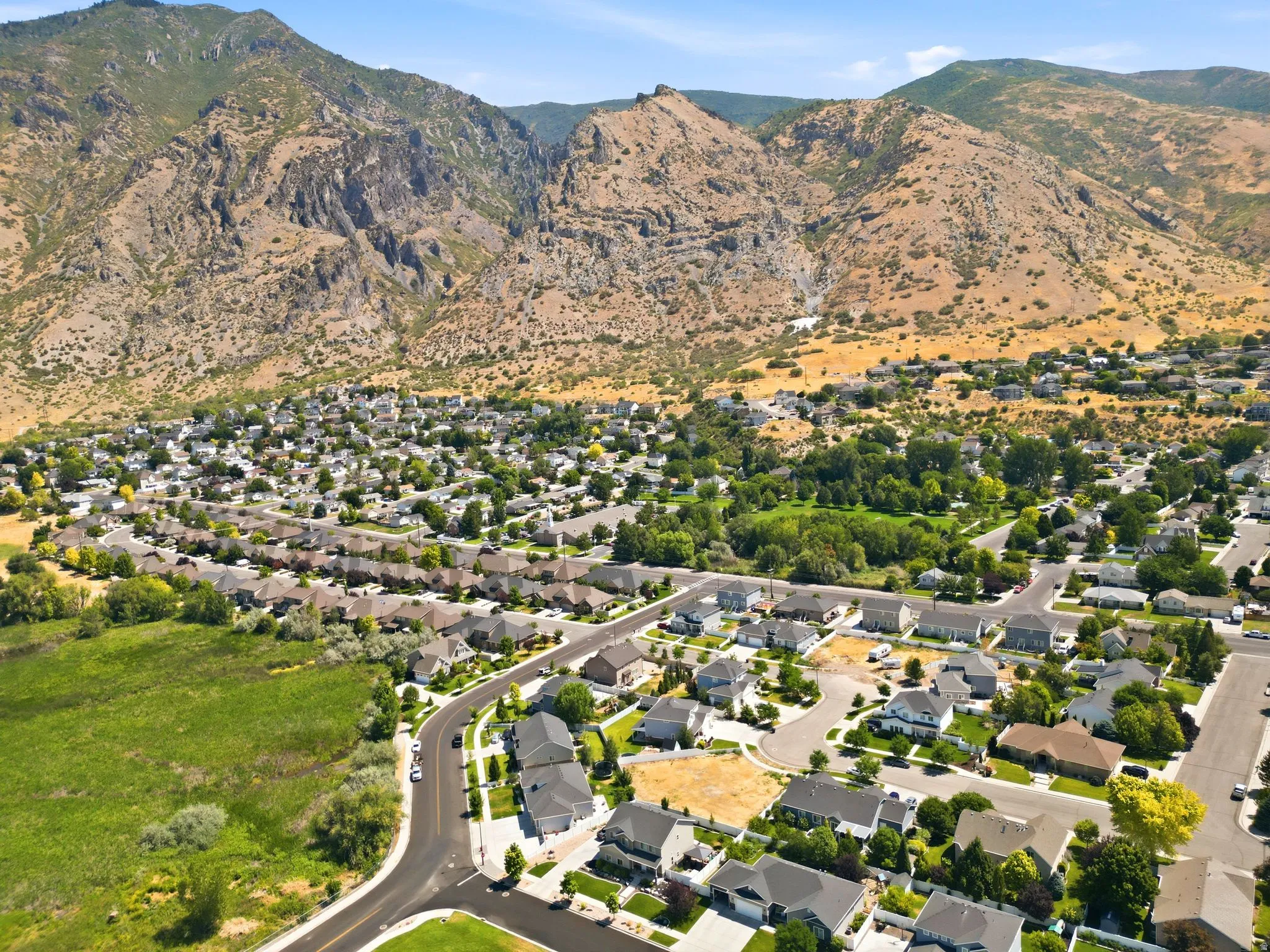 Expansive residential area featuring numerous single-family homes with varied rooflines and landscaping