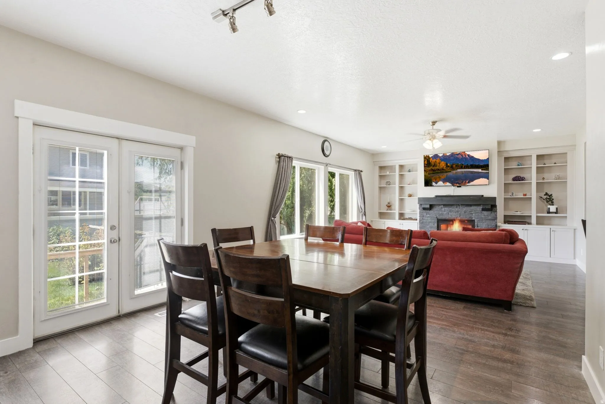 Open-concept living space with wood-finish flooring