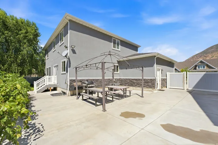 Expansive concrete patio with a permanent gazebo structure