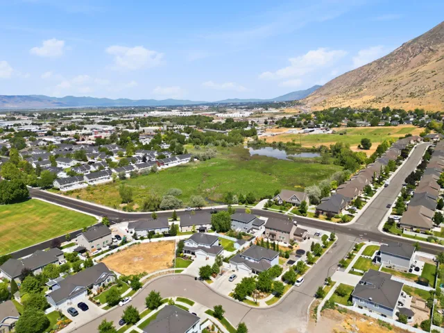 Aerial view showcasing a residential development with a mountain backdrop