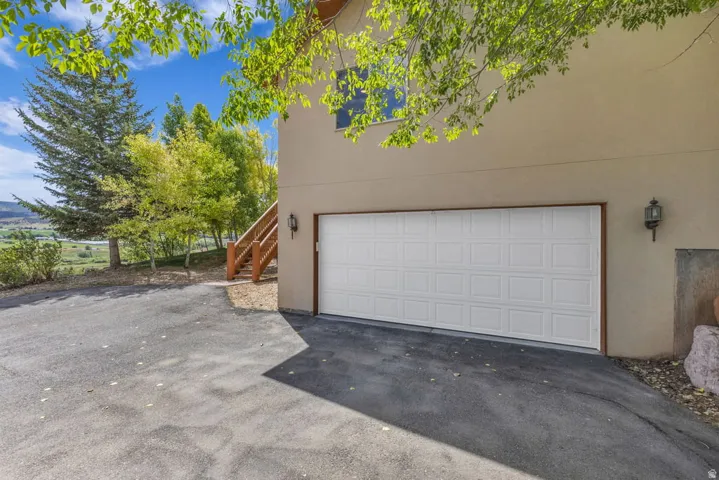 Single overhead garage door featuring a paneled design