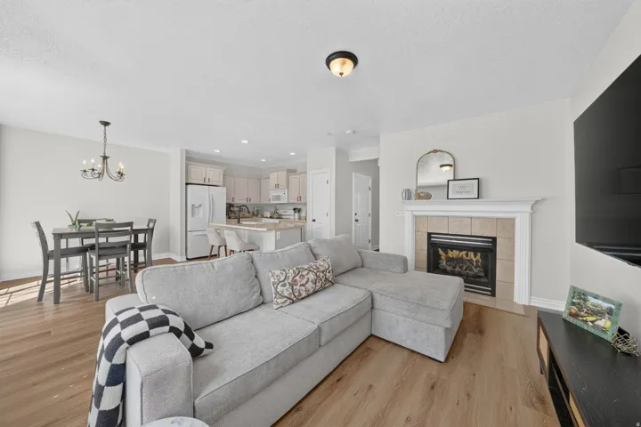 Open and airy great room featuring a gas fireplace and new LVP flooring