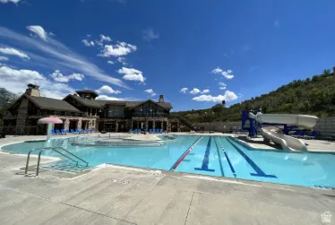 Outdoor pool features a waterslide and lazy river. Basketball courts & gym are not shown