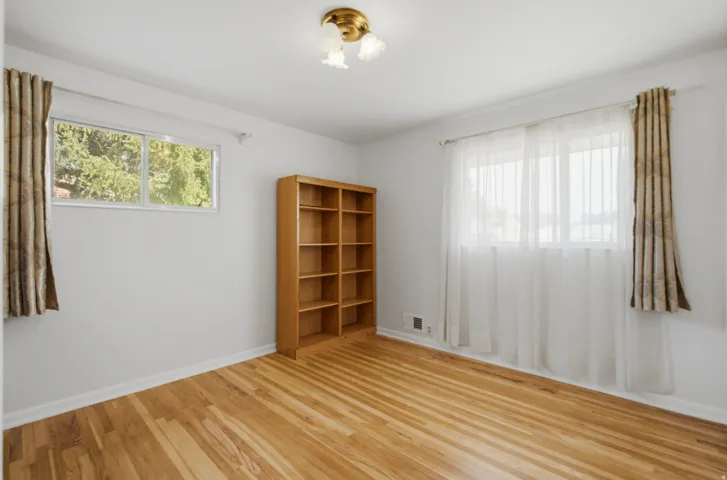 Hardwood flooring featuring natural light from multiple windows