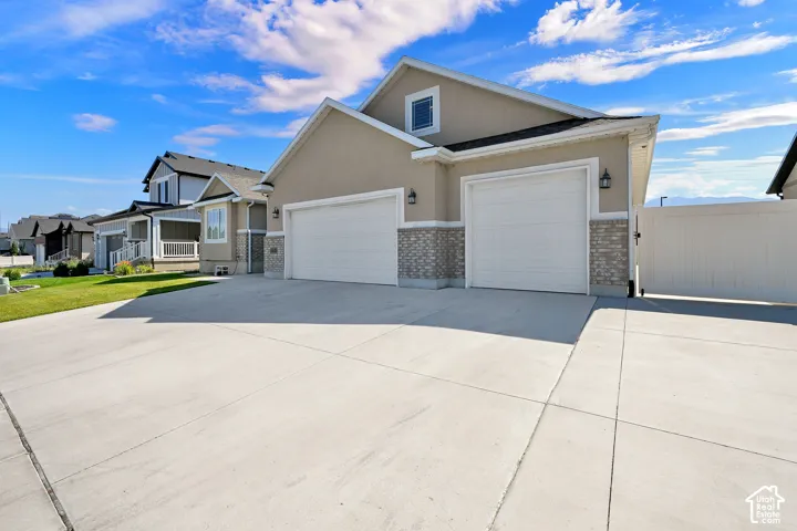 Contemporary stucco exterior with stone veneer accents
