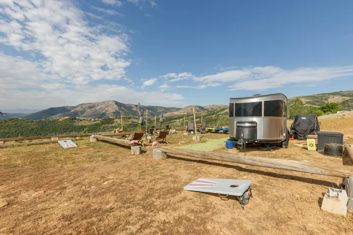 Terraced outdoor area featuring a silver-finish trailer