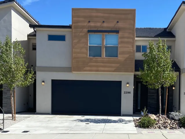 Contemporary stucco exterior with horizontal wood-finish accents