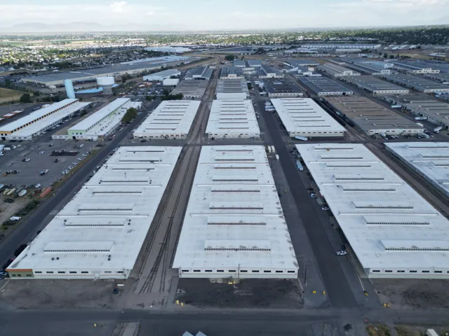Expansive industrial complex featuring multiple large-scale buildings with extensive rooftop areas