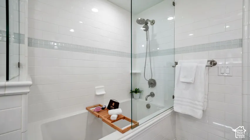 Master-Bathtub and shower combination featuring a glass enclosure