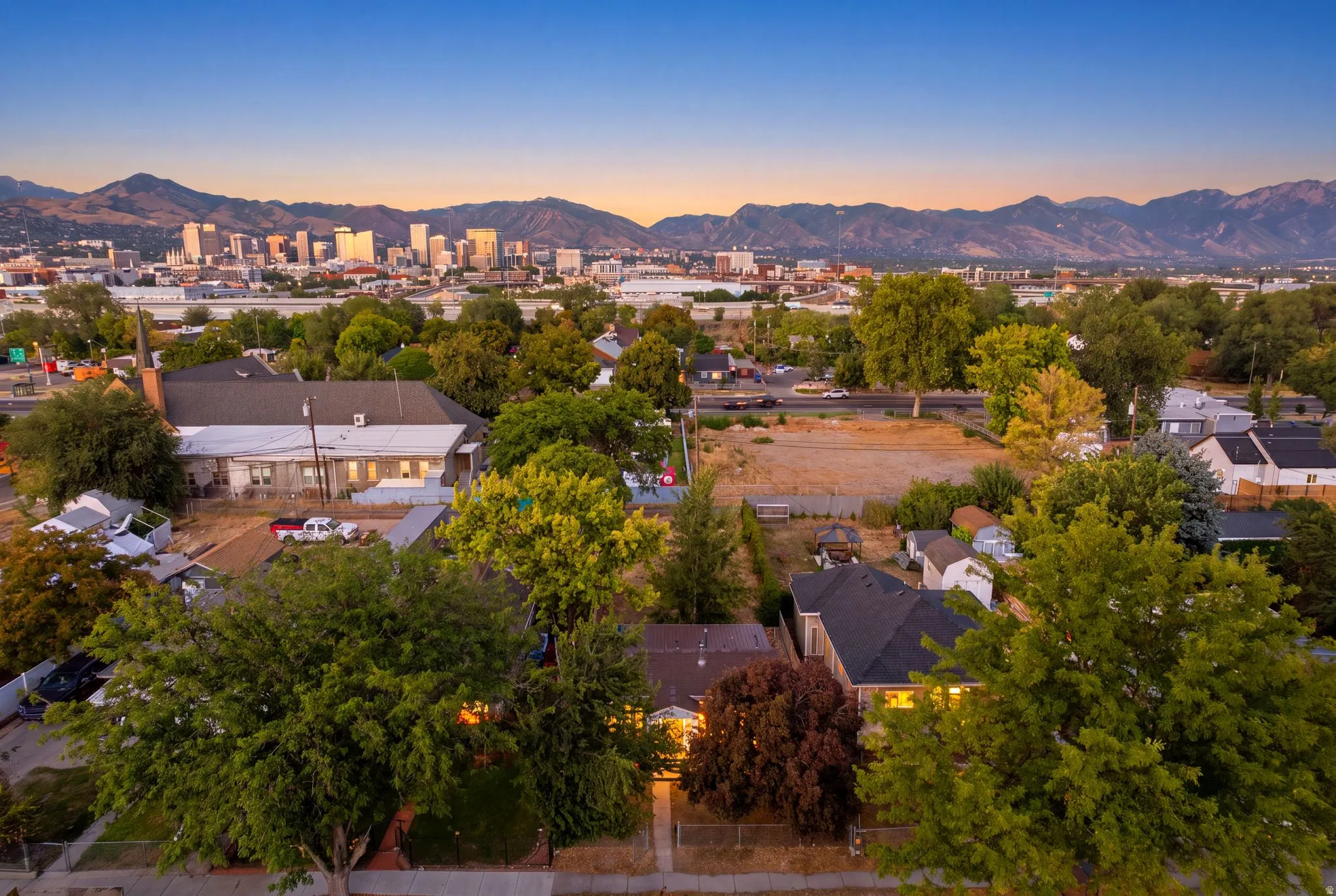 Urban skyline backdrop with surrounding mountainous terrain