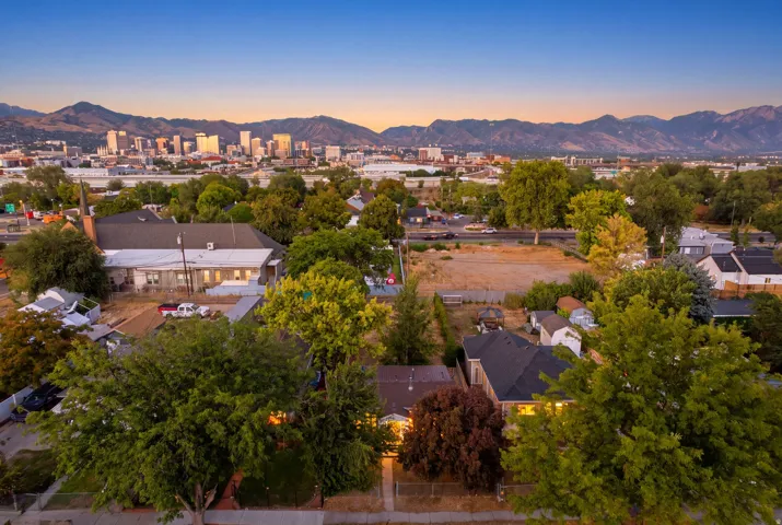 Urban skyline backdrop with surrounding mountainous terrain